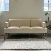Full front view of the beige soft leather couch with clean lines and modern design.