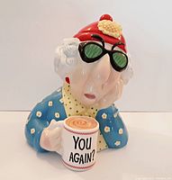 Front view of the Maxine ceramic cookie jar showing Maxine holding the 'YOU AGAIN?' mug.