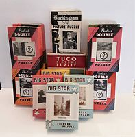 Photo showing the front and side arrangement of all puzzle boxes, highlighting branding and box designs for Perfect Double, Big Star, Buckingham Jig, and Tuco puzzles.