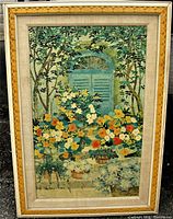 Full front view of framed lithograph print showing floral scene with blue shuttered window and trees, signed by Lydia Kemenyi.