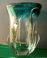 Front-right angled view of aqua and clear Seguso Murano polygonal glass vase with tadpole-shaped clear glass designs and wide rim.