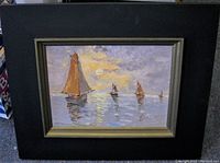 Full view of the framed oil painting showing impressionist sailboats on water with a sunset sky, highlighting the floating frame and condition.