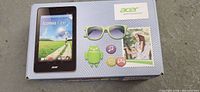 Front of box showing Acer Iconia One 7 tablet branding and green color indication
