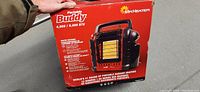 Front view of Mr Heater Portable Buddy heater box showing product image and main features.