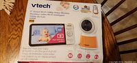 Front of the product box for VTech 5" Smart Wi-Fi baby monitor showing features and product image.
