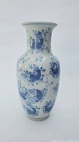 Front view of Chinese blue and white porcelain vase showing detailed bird and floral pattern.