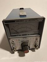 Front view of the Leader LMV-185A AC Millivoltmeter with analog meter, range knob, input jacks, and power indicator.