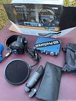 PreSonus Audiobox iTwo Studio kit including audio interface, headphones, microphone with shock mount, pop filter, and original box.