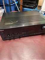 Front and top angled view of the Sherwood RX-4030 stereo receiver showing ventilation slots and control panel.