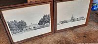 Two framed drawings showing Washington, DC scenes, arranged side by side on floor