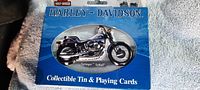 Blue Harley Davidson collectible tin with Springer Softail motorcycle image and sealed package