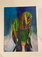 Front view of acrylic painting on canvas showing a green monster figure with a large upper body, long arms, and orange-red eyes, unframed.