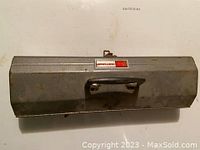 Top view of gray metal toolbox with carrying handle and Craftsman label