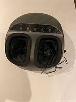 Top view of Renpho foot massager showing dual foot compartments and control panel.