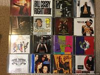 Top 4 rows of CD albums showing various artists and album cover art