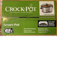 Photo of the top lid of the Crock-Pot Smart-Pot box showing brand, model, and key features including 7 quart capacity, removable stoneware, dishwasher safe, pre-set digital control up to 10 hours, shifts to warm setting automatically, recipes included.