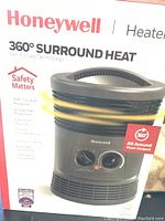 Box showing Honeywell 360 Degree Surround Heat heater branding and safety features.