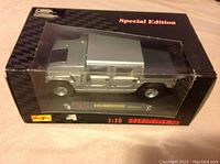 Silver Maisto 1:18 scale die cast metal Hummer Hard Top model vehicle in original packaging showing front and side profile.