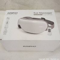 Product box showing Renpho Eye Massager model RF-EM001R with image and remote control on the package.