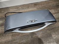 Top angled view of Fellowes Saturn 125 laminator showing power switch and ventilation.