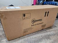 Sealed cardboard box labeled 'Outsunny', model 848-016V80GY, containing a frame above ground swimming pool set with filter pump.