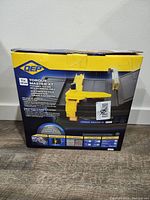Box packaging of QEP Torque Master XT 4-inch portable tile saw showing front with product image and specifications