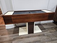 Front view of Electrohome Tempo console record player and radio receiver on pedestal base