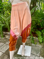 Close-up side/front angled view highlighting the 3-tone velvet fabric in pink, rose, and rust orange.