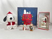 Front view of all Peanuts Christmas themed items and backdrop