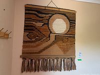 Full view front of the wall hanging showing abstract design and colors