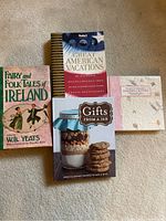 Four assorted books laid out showing titles and cover design.