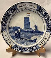 Full front view of the Delft commemorative plate showing the detailed blue and white artwork and inscriptions