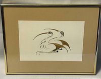 Framed Eddy Cobiness print featuring two stylized birds in brown, black, and white ink on paper with beige matte and metal frame.