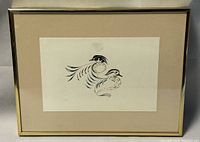 Frontal view of framed print featuring two stylized birds in black, brown, and gray on cream background.