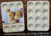 Photo of 2 white mini Bundt pans; one with 6 round molds and another with 12 flower-shaped molds