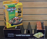 Perfect Tortilla pan set box and Chicago Metallic baked taco rack on display, showing item packaging and taco rack design.