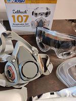 Zelbuck 107 respirator kit box and silicone half mask with organic filter cartridges, safety goggles visible in background