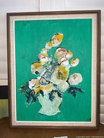 Front view of framed abstract floral painting with a green vibrant background showing the full composition.