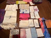 Large lot of various scarves and handkerchiefs, showing layout and condition.