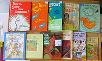 Photo showing 10 children's books including three Dr. Seuss titles plus various illustrated storybooks and sticker activity book.