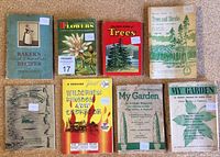 Photo of all 8 vintage books arranged in two rows showing various titles and years from 1932 to 1972.