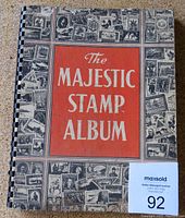 Front cover of the Majestic Stamp Album showing the vintage design with monochrome stamps border and red title block.