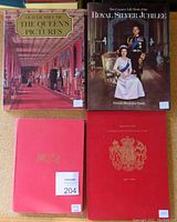 Four vintage royalty-related books arranged on a surface showing their covers and titles.