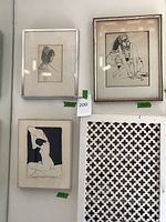 Three framed art pieces hanging on a white wall, each with price tags visible. Drawings depict female figures in black ink with some matting discoloration.