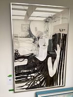 Full front view of ink drawing framed, showing composition of a woman with long hair and intricate lines in black ink on white paper.