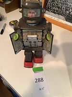 Front view with chest doors open showing lithographed panels