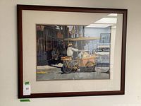 Frontal photo of the framed artwork showing a man on a Mexican street with a food cart.