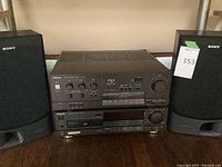 Front view of stereo system showing amplifier, CD player, and Sony speakers