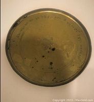 Top view of the antique Turkish tea plate showing the etched script along the circumference and central ornament.