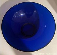 Top-down view showing the inner surface and depth of the bowl in deep blue glass.